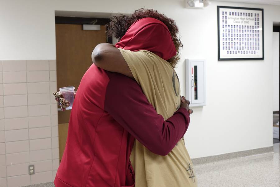 Keisha Ross, mother of one of Jaylan Murrays best friends, hugs her son at Arlington High School on February 4, 2016. | By Eric Weddle