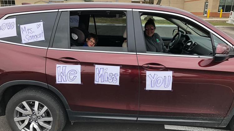 Some teachers taped signs to their cars before the parade line-up.  - Photo courtesy Amy Sargent viaFacebook