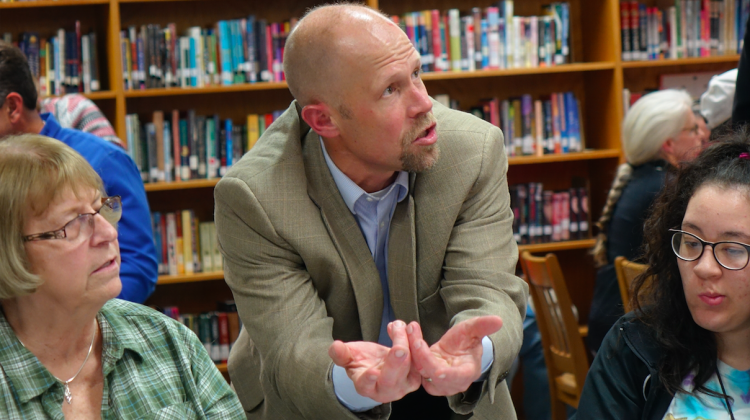 Charlie Schlegel talks to a group during a community meeting about the future of Emmerich Manual and Thomas Carr Howe high schools on Oct. 29, 2018, at Manual school library. - Eric Weddle/WFYI News