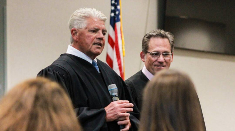 Indiana Court of Appeals Chief Judge Robert Altice, left, speaks to attendees at an Appeals on Wheels traveling oral argument at the Jewish Community Center in Indianapolis on June 26, 2025. Next to Altice is Judge Paul Felix. - Brandon Smith / IPB News