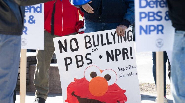 People participate in a rally to call on Congress to protect funding for public broadcasters PBS and NPR outside the NPR headquarters in Washington, DC, on March 26, 2025. - Saul Loeb / AFP / Getty Images