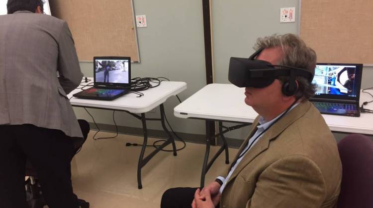 State Sen. Brandt Hershman, R-Buck Creek, tries on an Oculus Rift virtual reality headset at Hope Academy in Indianapolis on Thursday, Aug. 10, 2017. - Eric Weddle/WFYI News