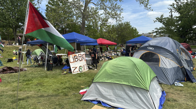 A Palestinian flag waves over a pro- Palestinian protest encampment at Indiana University Bloomington, Wednesday, May 1, 2024, in Bloomington, In. - Isabella Volmert / AP Photo