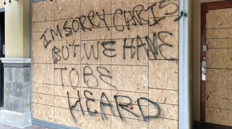 In Indianapolis, the first business with a broken window was Jack's Donuts, just east of the Statehouse. Protesters left a message for the owner after the clashes with police: "I'm sorry Chris, but we have to be heard." - Lauren Chapman/IPB News