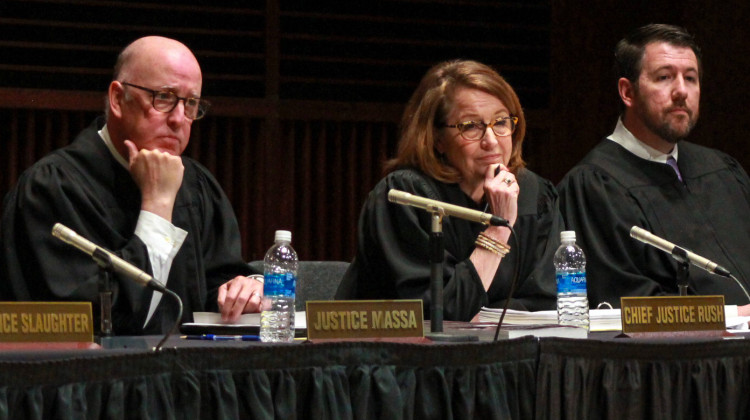 From left, Indiana Supreme Court Justice Mark Massa, Chief Justice Loretta Rush and Justice Derek Molter listen to student questions at a traveling oral argument at the University of Indianapolis on Apr. 11, 2023. - Brandon Smith/IPB News