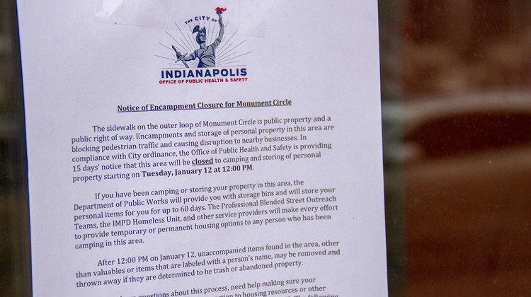 The notice posted around Monument Circle says camping and storing personal property will be prohibited beginning at noon on Jan. 12 - Doug Jaggers/WFYI