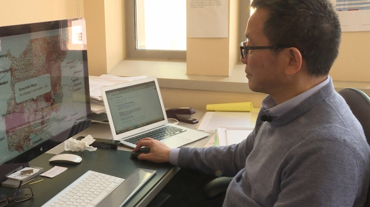 Indiana University Professor Chen Zhu shows how people can use the mapping tool to find out how much water might be lost in their community in the future. - Rebecca Thiele/IPB News