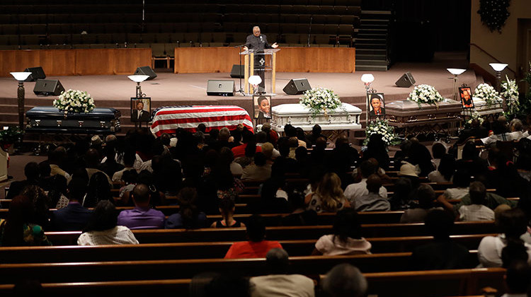 Bishop William Harris speaks during the funeral for Horace Coleman, Belinda Coleman, Irvin Coleman, Angela Coleman and Maxwell Coleman Ly, Saturday, July 28, 2018, in Indianapolis. Nine members of the Coleman family were killed in a duck boat accident at Table Rock Lake near Branson, Missouri. - AP Photo/Darron Cummings