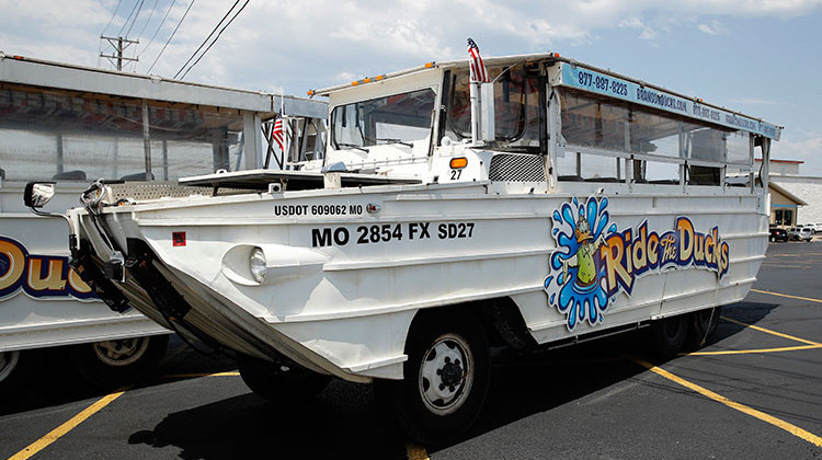 A duck boat sits idle in the parking lot of Ride the Ducks, an amphibious tour operator in Branson, Mo. Friday, July 20, 2018. The amphibious vehicle is similar to one of the company's boats that capsized the day before on Table Rock Lake resulting in 17 deaths. - AP Photo/Charlie Riedel