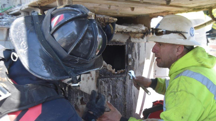 Rescuers work to rescue 34-year-old Billy Joe Walls from a gravel silo. - Provided by Indianapolis Fire Department