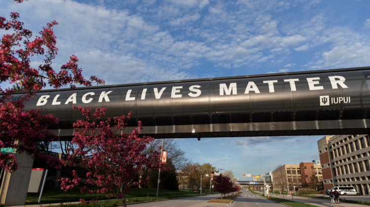 A banner displaying the message "Black Lives Matter" is pictured on a walkway over Michigan Street at IUPUI's campus on April 21, 2022. - Liz Kaye / Indiana University Indianapolis University Library Special Collections and Archives