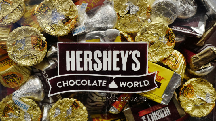 A mixture of Hershey's chocolates is displayed in the company's Times Square store, Wednesday, March 1, 2017, in New York. Hershey is expanding its salty snack portfolio with the purchase of Dot’s Homestyle Pretzels. The Hershey Co. said Wednesday, Nov. 10, 2021, that it will spend $1.2 billion for North Dakota-based Dot’s Pretzels as well as Pretzels Inc., an Indiana-based manufacturer of Dot’s Pretzels that operates three plants. - (AP Photo/Mark Lennihan, File)