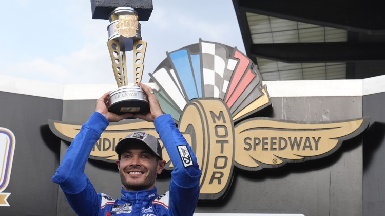 Kyle Larson holds the trophy after winning a NASCAR Cup Series auto race at Indianapolis Motor Speedway, Sunday, July 21, 2024, in Indianapolis. - Darron Cummings / AP Photo