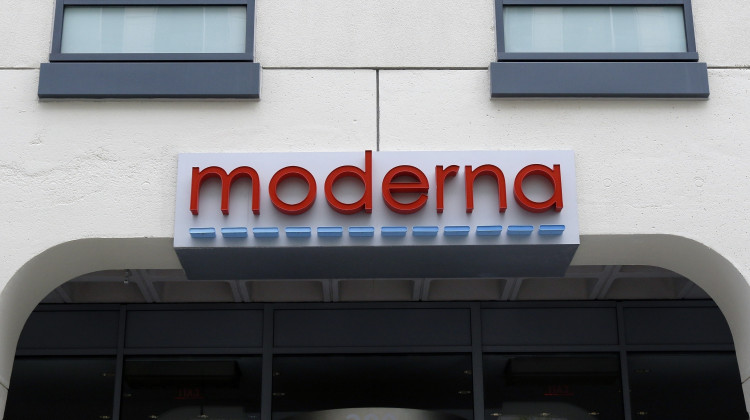 A sign marks an entrance to a Moderna building in Cambridge, Mass., on May 18, 2020. (AP Photo/Bill Sikes, File)