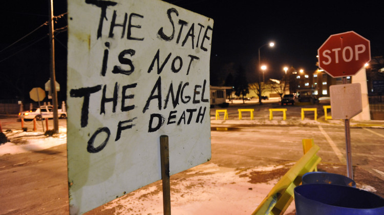 A sign placed by death penalty opponents sits in front of the Indiana State Prison in Michigan City, Ind., Dec. 10, 2009, in protest of the execution of Matthew Eric Wrinkles, who was the last Indiana inmate to be executed. - Joe Raymond / AP Photo