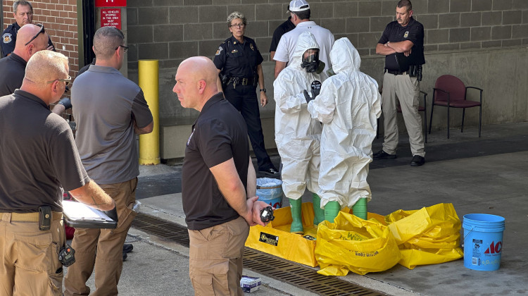 A hazmat crew from the National Guard's Civilian Support Team investigates after a suspicious package was delivered to election officials at the Missouri Secretary of State's Jefferson City, Mo., office on Tuesday Sept. 17, 2024. - Summer Ballentine / AP Photo