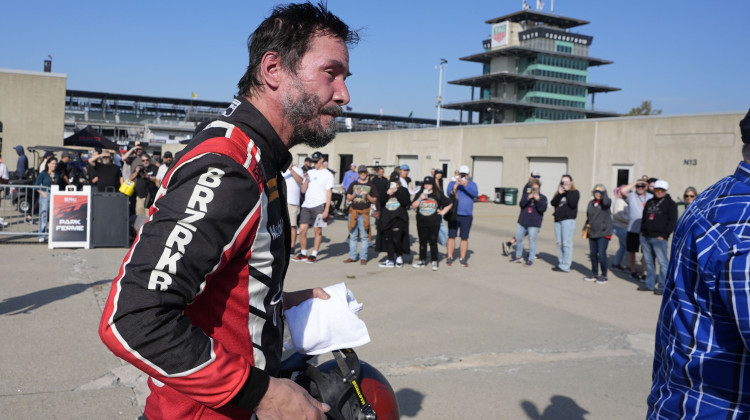 Keanu Reeves walks in the garage area following a GR Cup Series auto race at Indianapolis Motor Speedway, Saturday, Oct. 5, 2024, in Indianapolis. -  (AP Photo/Darron Cummings)