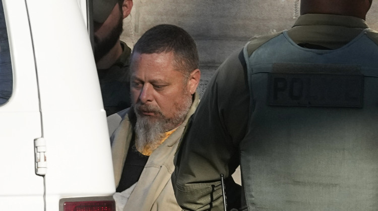 FILE - Officers escort Richard Allen out of the Carroll County courthouse following a hearing, Nov. 22, 2022, in Delphi, Ind. Allen, of Delphi, is scheduled to go on trail Oct. 14, 2024 for the slayings of two teenage girls, Liberty German, 14, and Abigail Williams, 13, who were killed while hiking in 2017 near their small community in northern Indiana hometown.  - Darron Cummings / AP Photo