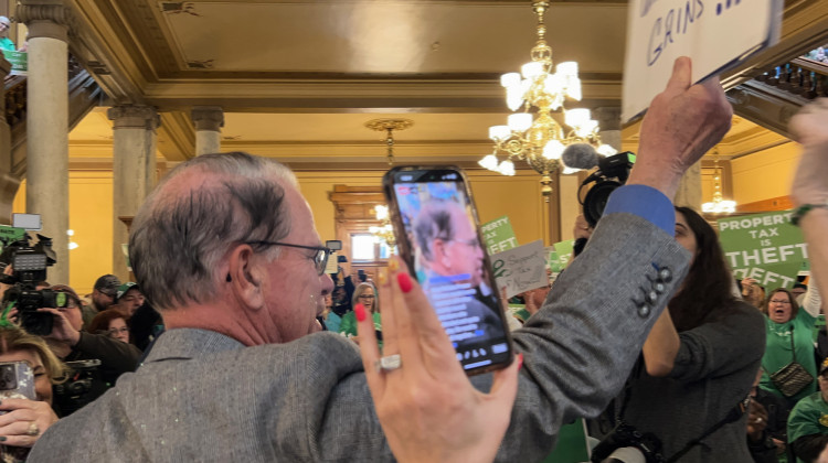 Gov. Mike Braun waded into a crowd rallying at the Statehouse to speak about property tax relief on March 17, 2025.  - Brandon Smith / IPB News