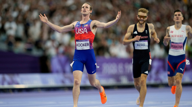 Cole Hocker, of the United States, crosses the finish line ahead of Josh Kerr, of Britain, and fourth placed Jakob Ingebrigtsen, of Norway, to win the men's 1500 meters final at the 2024 Summer Olympics, Tuesday, Aug. 6, 2024, in Saint-Denis, France. - Ashley Landis / AP Photo