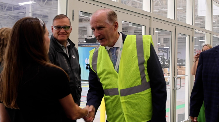 Under Secretary for Infrastructure David Crane shakes hands with a Cummins employee. He toured the Columbus Engine Plant as part of the grant announcement. - Lucinda Larnach / WTIU