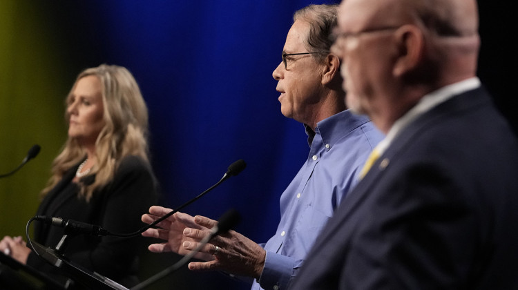 Republican candidate Sen. Mike Braun, R-Ind., middle, speaks during a debate for Indiana governor hosted by the Indiana Debate Commission at WFYI, Thursday, Oct. 24, 2024, in Indianapolis. - Darron Cummings / AP