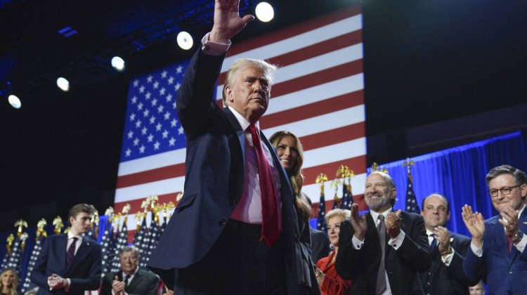 Republican presidential nominee former President Donald Trump waves as he walks with former first lady Melania Trump at an election night watch party at the Palm Beach Convention Center, Wednesday, Nov. 6, 2024, in West Palm Beach, Fla. - Evan Vucci / AP