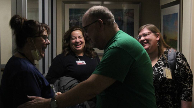 Timothy Moss (right center) was part of a program out of the Indiana University Health system, which connects hospital patients with "connectors" who help fill support needs, including spiritual needs, in the life of the patient. - Ben Thorp / WFYI