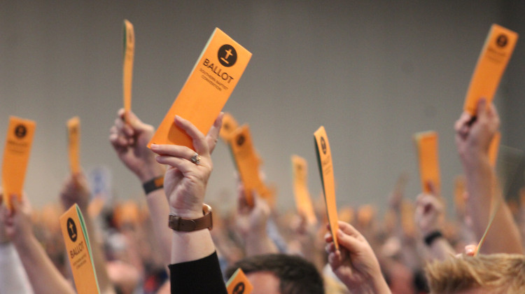 Members of the Southern Baptist Convention raise their ballots during a vote. The convention approved a resolution opposing in vitro fertilization on Wednesday, June 12, 2024 at the Indiana Convention Center in Indianapolis. - WFYI / Ben Thorp