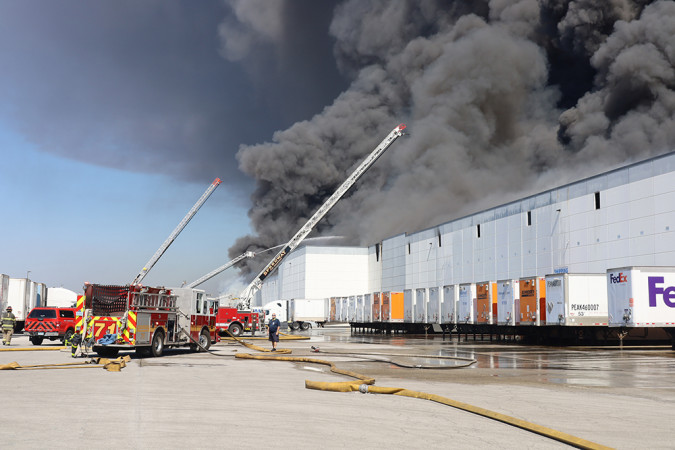 Firefighters battling five alarm warehouse blaze in Plainfield