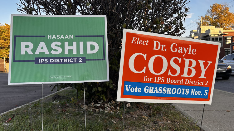 Signs for Gayle Cosby and Hasaan Rashid, candidates for the District 2 seat on the Indianapolis Public Schools board, sit off College Avenue in Indianapolis. Rashid has raised roughly $43,110, with Cosby at $31,475. - Eric Weddle / WFYI