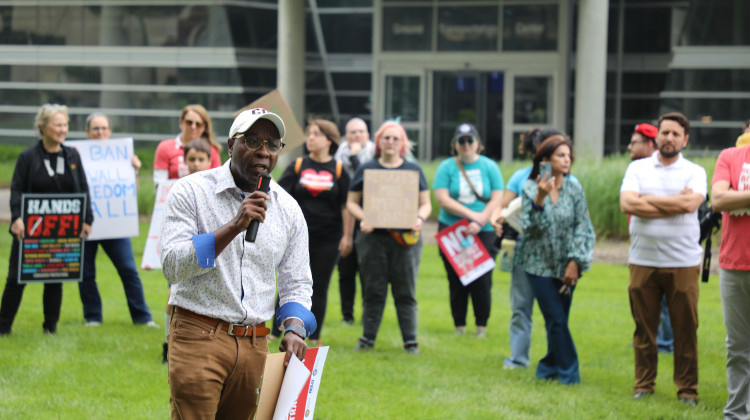 Haitian Association of Indiana executive director Leonce Jean-Baptiste speaks to attendees at the rally about how the travel ban will harm the Haitian community. - Samantha Horton / WFYI