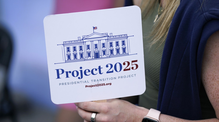 A Project 2025 fan held by supporter at the group's tent at the Iowa State Fair, Aug. 14, 2023, in Des Moines, Iowa. The Project 2025 effort is being led by the Heritage Foundation think tank. - AP Photo/Charlie Neibergall