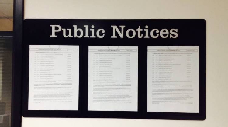 A posting of public meetings outside an office at the Indiana Government Building South - Eric Weddle / WFYI Public Media