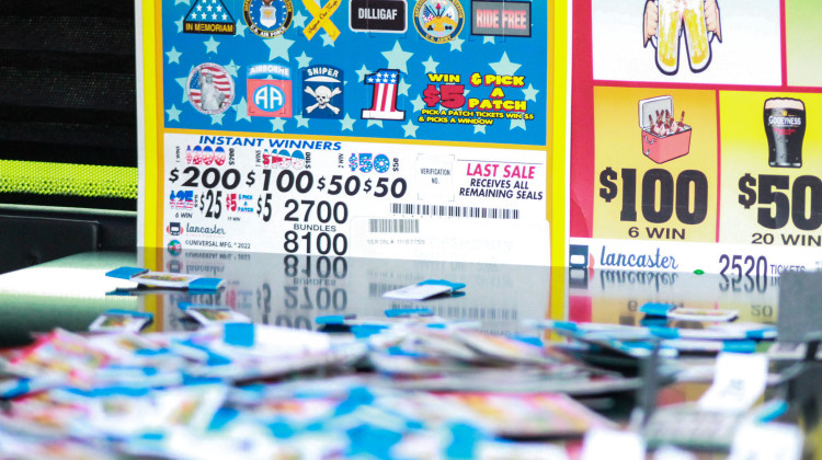 Currently, veterans groups like the American Legion and the Veterans of Foreign Wars can offer paper pull tabs for charity gaming – like these, displayed as part of a demonstration. - Brandon Smith / IPB News