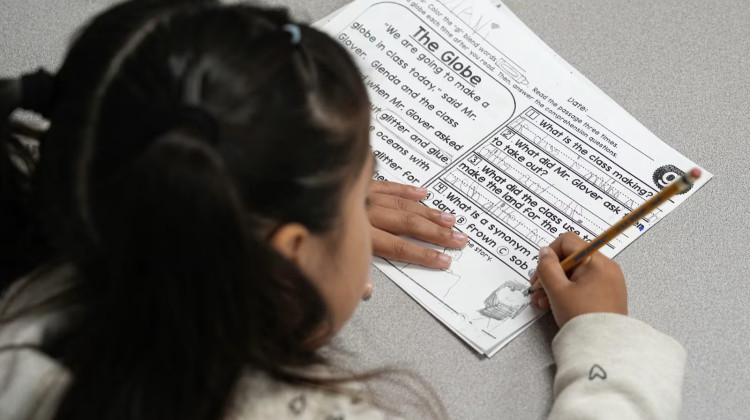 A first grader works through a reading and writing exercise at Pleasant Run Elementary School in Warren Township. - Jenna Watson / Mirror Indy