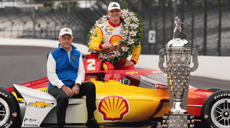Roger Penske and Josef Newgarden pose with the Borg-Warner Trophy during the traditional winners photo session at Indianapolis Motor Speedway, Monday, May 27, 2024, in Indianapolis. Newgarden won the 108th running of the Indianapolis 500 auto race Sunday. - Darron Cummings / AP Photo
