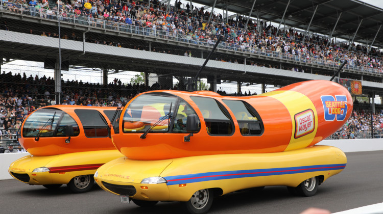 Two of the Weinermobiles that took part in the first-ever “Wienie 500" race held on Friday, May 23, 2025 at the Indianapolis Motor Speedway. - Samantha Horton / WFYI