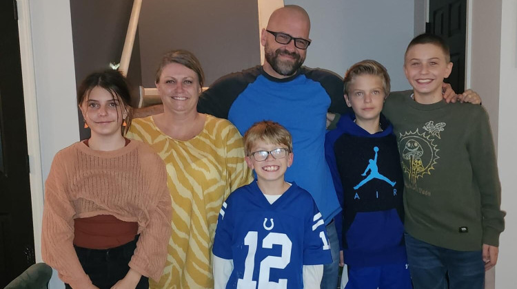 The Teusch family poses for a photo with Sammy, who is in the center. - Courtesy of the Teusch family