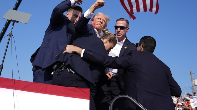 Republican presidential candidate former President Donald Trump is surrounded by U.S. Secret Service agents at a campaign rally, Saturday, July 13, 2024, in Butler, Pa.  - Evan Vucci / AP Photo