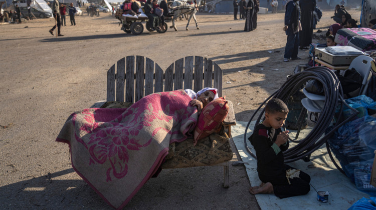 Palestinians displaced by the Israeli bombardment of the Gaza Strip gather at a tent camp, in Rafah, southern Gaza strip, Monday, Dec. 4, 2023. - Fatima Shbair / AP Photo