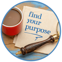 find your purpose note on desk with mug and magnifying glass